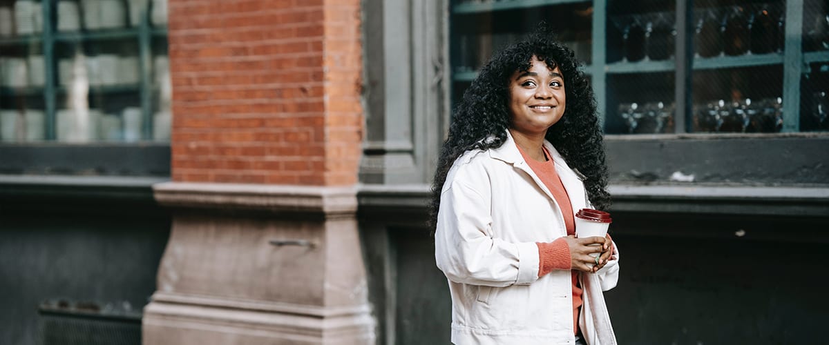 Women on Daily Walk holding coffee | Specialist Utilities Recruitment